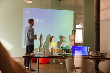 Business people preparing audio visual presentation on Focus
