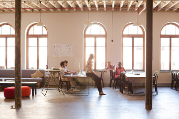 Casual business people talking in meeting in office