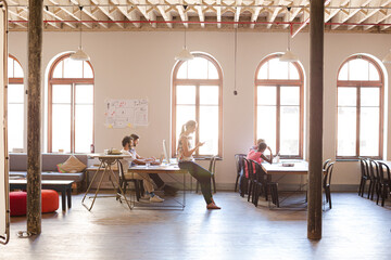 Casual business people talking in meeting in office