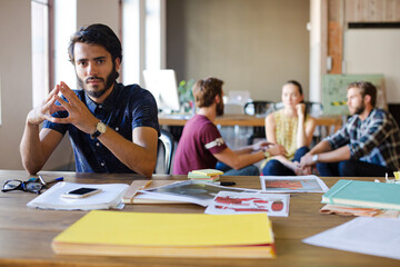 Portrait confident casual businessman in sunny office
