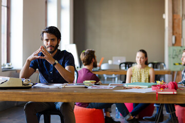 Portrait confident casual businessman in sunny office