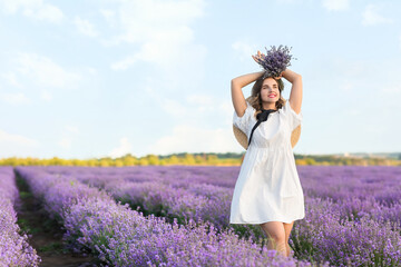 Beautiful young woman in lavender field