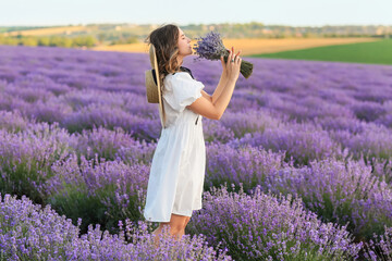 Beautiful young woman in lavender field