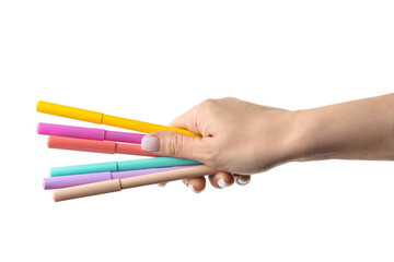 Woman holding different colorful markers on white background