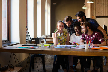 Creative business people brainstorming and working in office