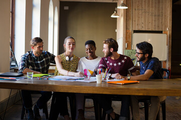 Creative business people brainstorming and working in office