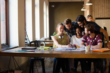 Creative business people brainstorming and working in office