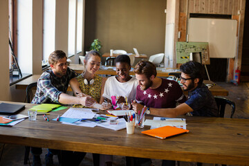 Creative business people brainstorming and working in office