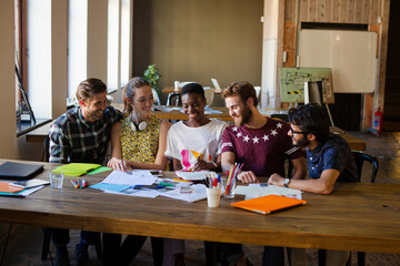 Creative business people brainstorming and working in office