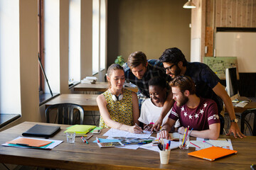 Creative business people brainstorming and working in office