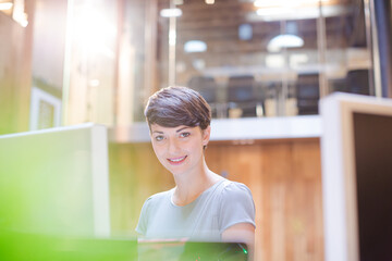 Businesswoman working on computer in office