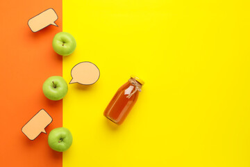 Bottle of tasty juice, apples and blank speech bubbles on color background