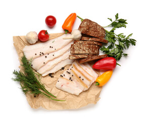 Slices of salted lard with fresh vegetables and bread on white background