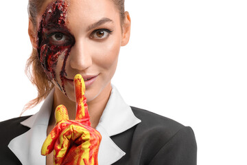 Woman dressed for Halloween as chambermaid showing silence gesture on white background