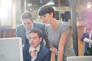 Business people working at computer in office