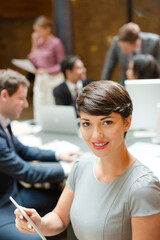 Smiling businesswoman posing in office