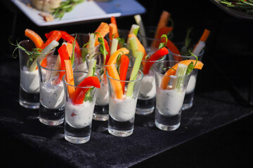 Vegetables in sauce on a buffet table, sweet paprika and carrots
