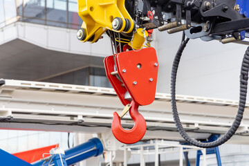 A close-up of the hook of a new mobile crane. Wheeled construction equipment. Parts of construction equipment © hodim