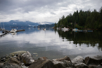 Close-up shot of the Deep cove. mountains and village. yacht harbor with docked boats. 