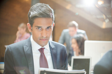 Portrait of smiling businessman in office