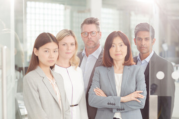 Fototapeta premium Portrait of confident business people in sunny office