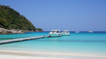 Beautiful blue sea and clear beach landscape of the sunny day with bright sky Racha Island