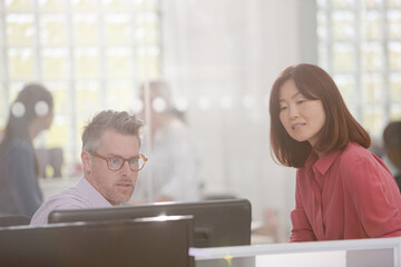 Business people working at computer in office