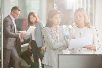 Businesswomen talking in office