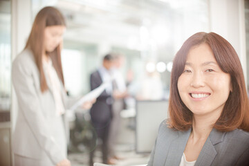 Portrait of smiling businesswoman in office