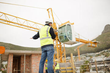 Construction worker with walkie-talkie at construction site