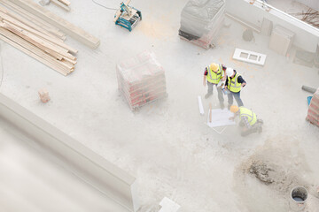 Overhead view of construction workers at construction site