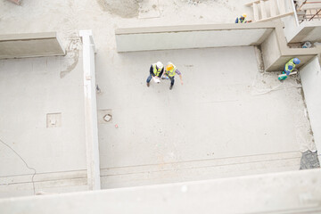 Overhead view of construction workers at construction site