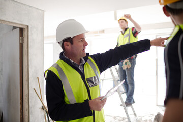 Foreman with digital tablet at construction site