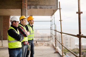 Construction workers at highrise construction site