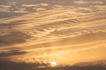 Golden clouds in dramatic light at sunset