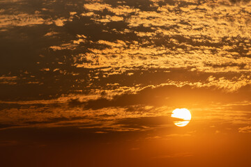 Golden clouds in dramatic light at sunset