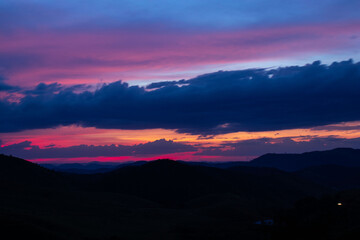 sunset, mountains, valleys, landscape, golden hour, orange sky.
blue and orange sky