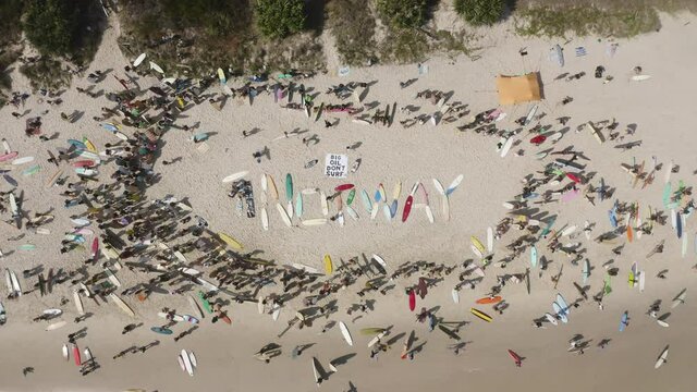 4k Top view drone shot of the protest on the beach shore against norwegian oil company at Byron Bay, New South Wales, Australia - 2019