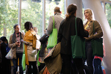 People talking in hall of auditorium