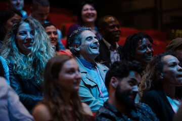 Happy audience in dark room