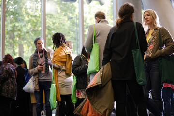 People talking in hall of auditorium