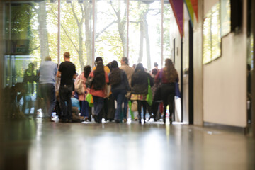 People talking in hall of auditorium