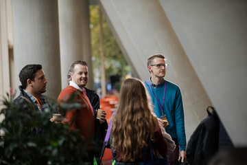 Speakers talking with audience