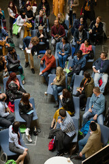 Fototapeta na wymiar Conference audience watching speakers on stage