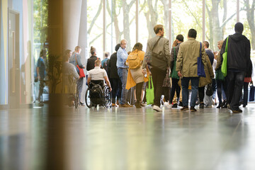 People waiting in hall of auditorium