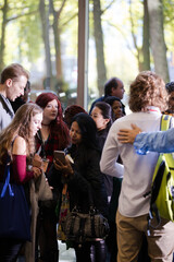 People talking in hall of auditorium