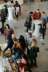 People talking in hall during conference break