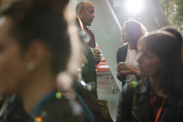 Conference audience watching speakers on stage