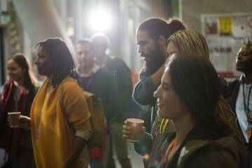 People waiting in hall of auditorium