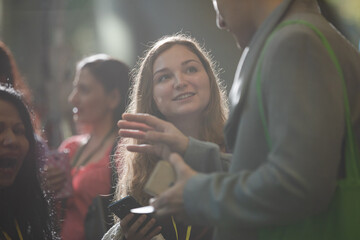 People talking in hall of auditorium
